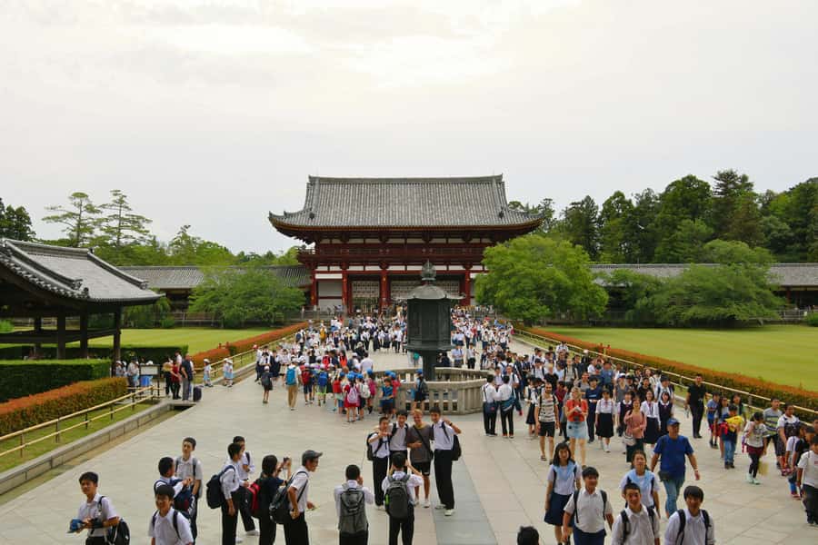 From Osaka: Nara, Kiyomizu-dera & Fushimi Inari Trip - Walking beneath Fushimi Inari’s red torii gates