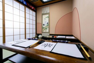 Learning Zen of Japanese Calligraphy in kimono near Osaka Castle
