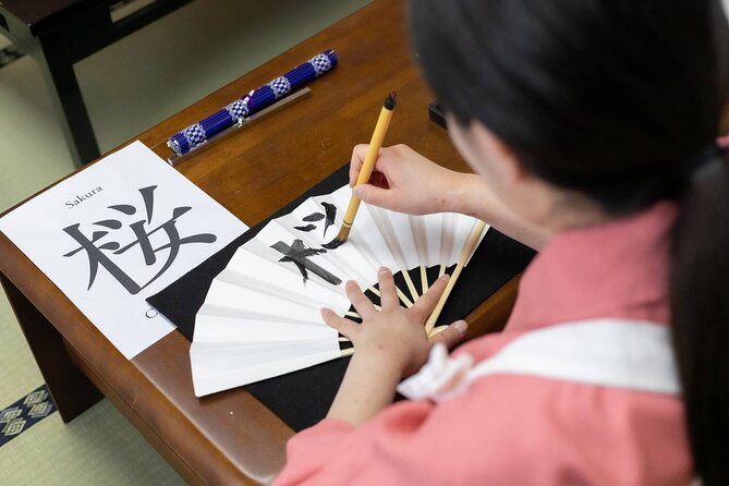 Learning Zen of Japanese Calligraphy in kimono near Osaka Castle - A wooden tag with your name in kanji