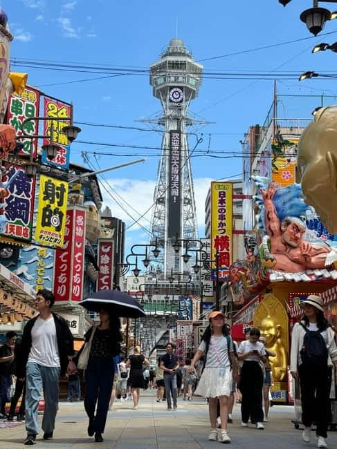 Osaka: 1-Day Guided Tour - Sky Bldg, Castle, Namba Shinsekai - Shinsekai and the shooting gallery finale