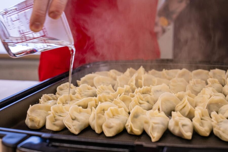 Osaka: Cooking Class & Sake Tasting with Local Market Visit - Cooking niku-sui, okonomiyaki, and gyoza