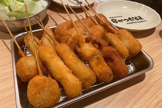 Osaka Highlights Walking Tour: Castle, Dotonbori & Hidden Gems - Tsutenkaku marks the move into Shinsekai