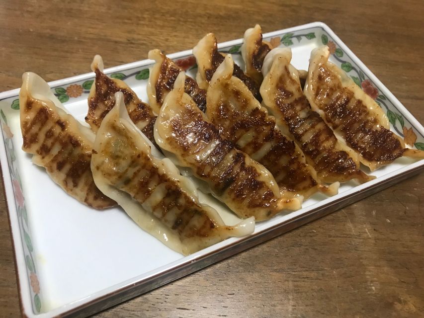 Osaka: Ramen and Gyoza Cooking Class in Dotonbori - Folding minced chicken gyoza