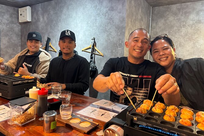 Osaka Sake Tasting & Takoyaki Cooking Experience - Making takoyaki from batter to crisp little balls