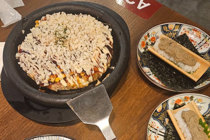 Osaka: Shinsekai Food Tour - 13 Dishes at 5 Local Eateries - Walking through Shinsekai’s neon streets