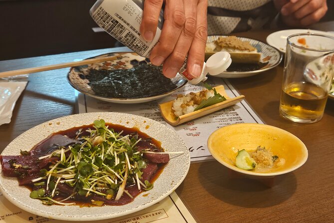 Osaka: Shinsekai Food Tour - 13 Dishes at 5 Local Eateries - A close look at Tsutenkaku Tower