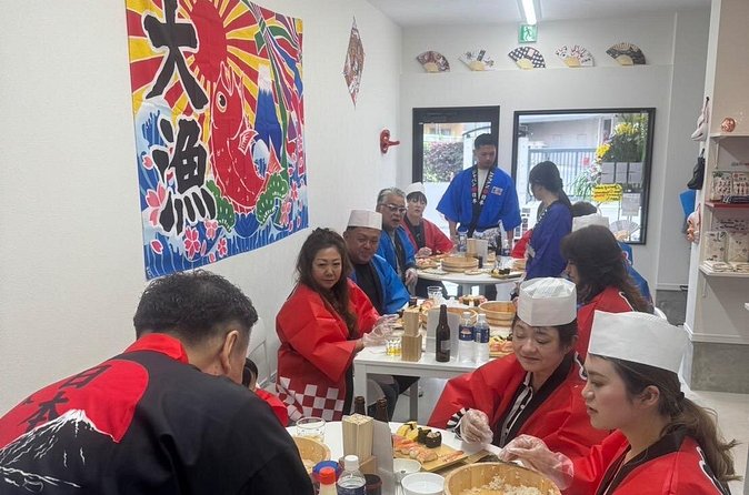 Osaka Sushimaking Experience - Wearing a happi coat and taking photos