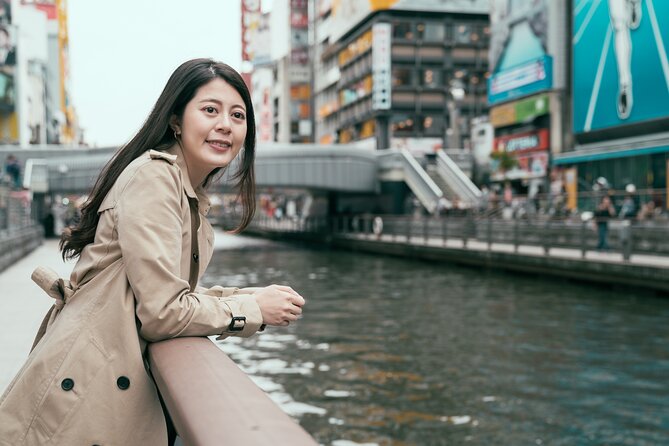 Osaka Unveiled Private Tour: Bustling Streets to Serene Shrines - Crossing Ebisu Bridge above the Dotonbori canal
